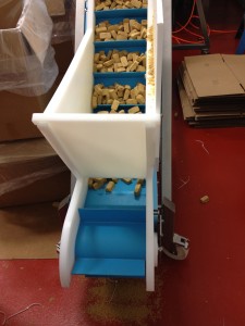 Food processing through an angular conveyor