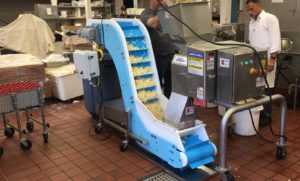 DynaClean incline conveyor with sliced potatoes
