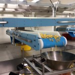 DynaClean flat food grade conveyor being used in the making of candy.