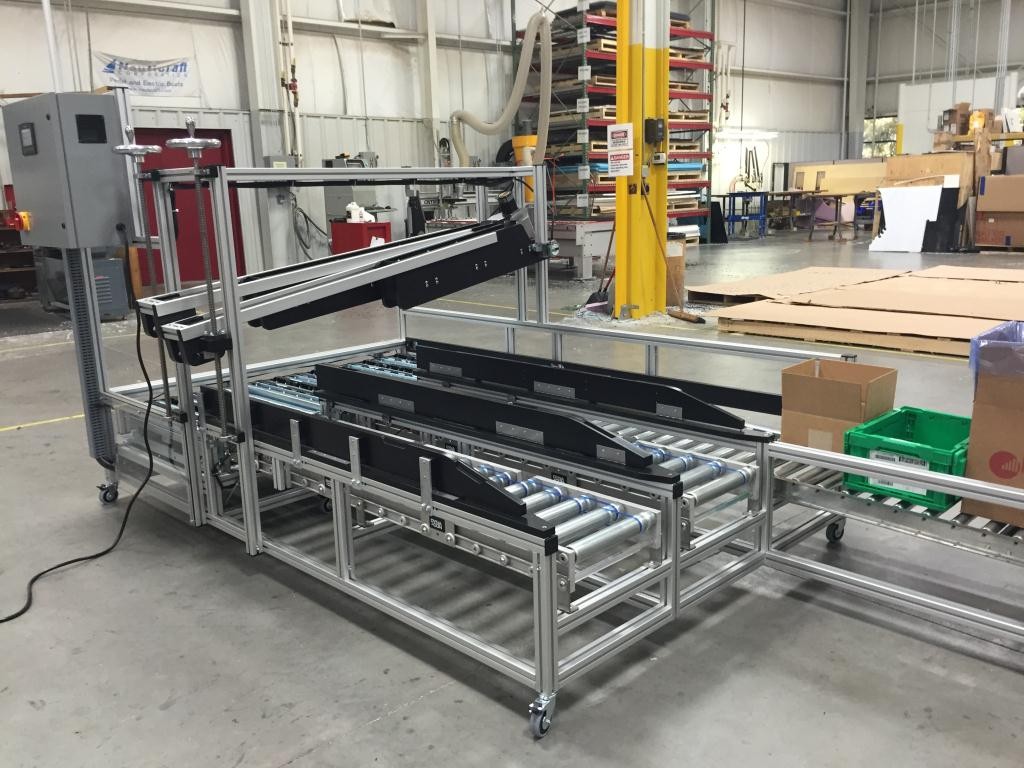 DynaCon box filling conveyors for a variety of different box or tote container sizes.