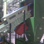 ngled Incline Parts Conveyor Feeding Into Hopper