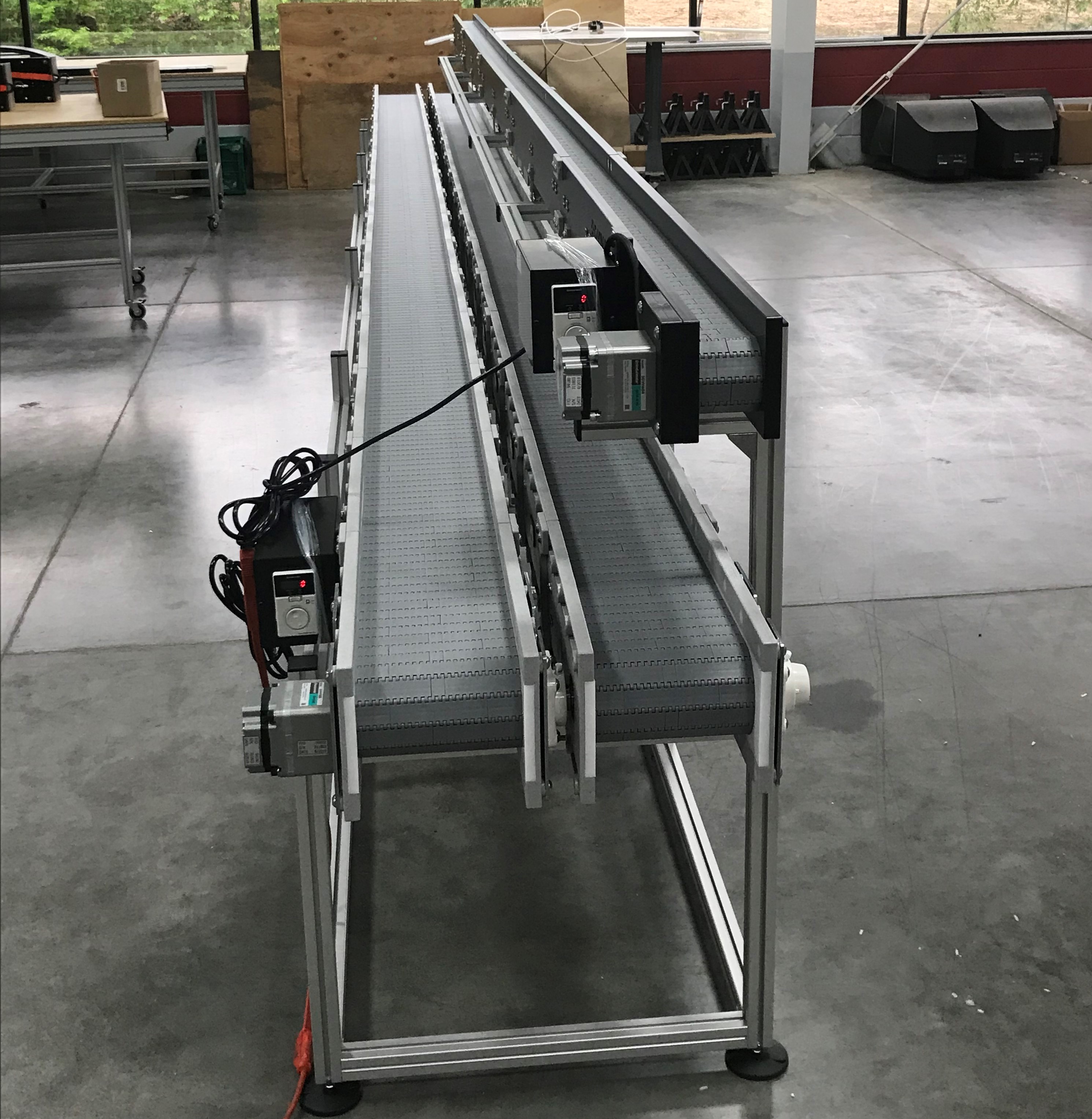 Three flat DynaCon conveyors incorporated for a co-packing operation