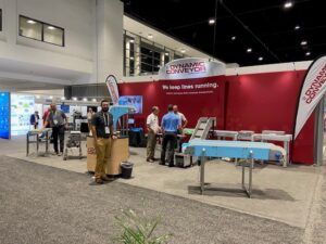 A wide shot of the Dynamic conveyor booth at Pack expo 2022