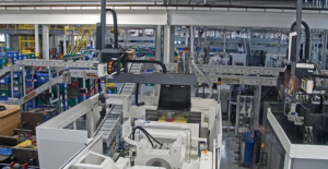 Conveyors allowing more automation in a facility that manufactures injection molded car mirror components