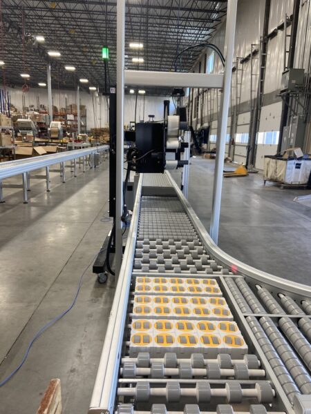 A DynaRoller powered roller conveyor in a facility for cartons and soft mailer packages