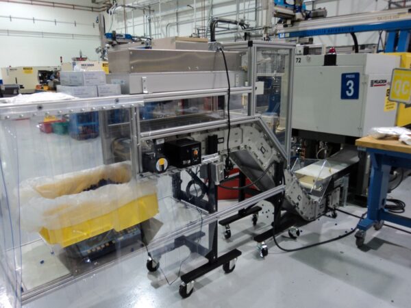 DynaCon Z style conveyor with metal detection equipment installed for medical molding company