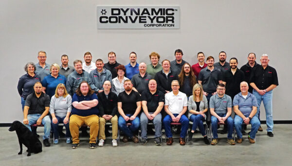 A group picture of Dynamic Conveyor employees and a cute dog