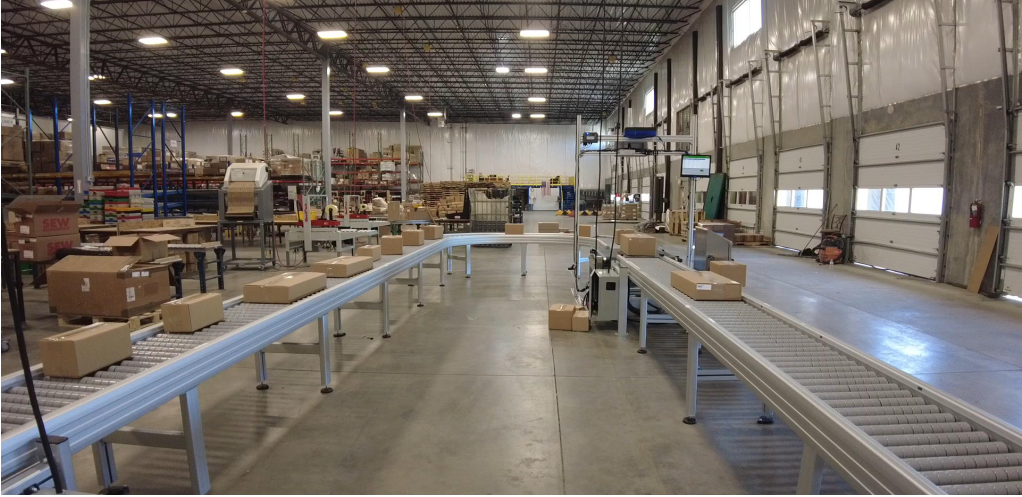 A DynaRoller zone powered roller conveyor integrated with existing distribution center technology
