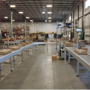 A DynaRoller zone powered roller conveyor integrated with existing distribution center technology