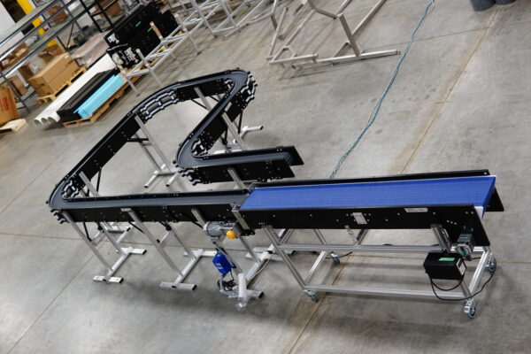 A skinny conveyor with multiple radius turns