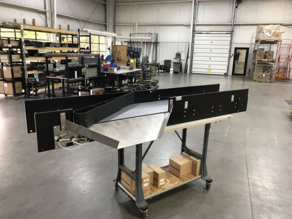 A Hybrid conveyor with a diverting arm