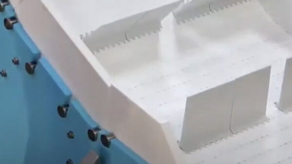 A close up of the drive flights on a DynaClean conveyor