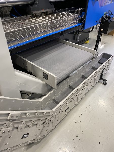A DynaPro low profile conveyor in a plastics manufacturing facility