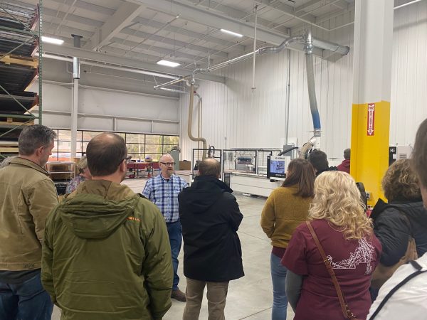 Roy Garn, Dynamic Conveyor's Production Supervisor, Speaking to a group of Muskegon area teachers on the conveyor manufacturing floor