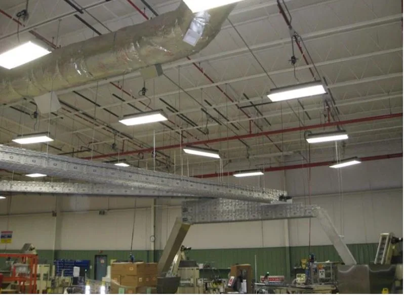 overhung trunkline conveyor installed near ceiling of facility
