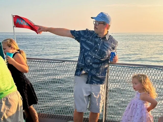 Ted Lewis pointing out at Lake Michigan