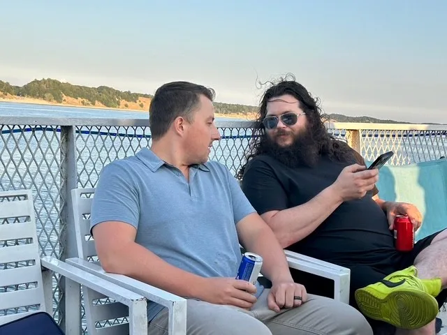Tyler and Josh of Dynamic Conveyor, talking on the deck of the cruise