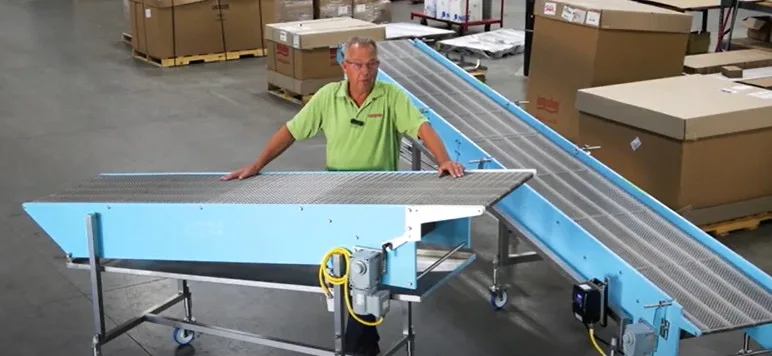 Dynamic Conveyor staff standing in by conveyor systems for fried food manufacturer