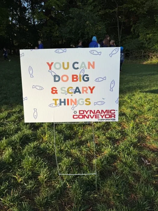 Sponsored elementary school walkathon sign with Dynamic Conveyor logo
