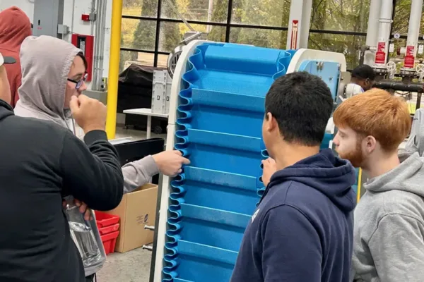 Students-dynaclean-conveyor-2025 Students learning about dynaclean conveyor manufactured by Dynamic Conveyor Corporation in Norton Shores, MI