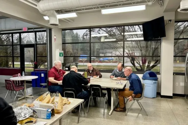 Souper-Social-Group1 Employees sitting at table eating soups