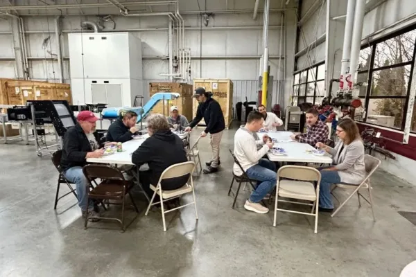 Souper-Social-Group2 group of Dynamic Conveyor employees eating soup at the 2025 Souper Social event