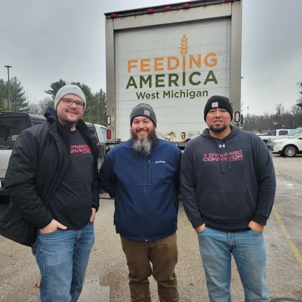 Feeding-America-WM_Volunteers Dynamic Conveyor volunteers in front of Feeding America West Michigan Food Truck