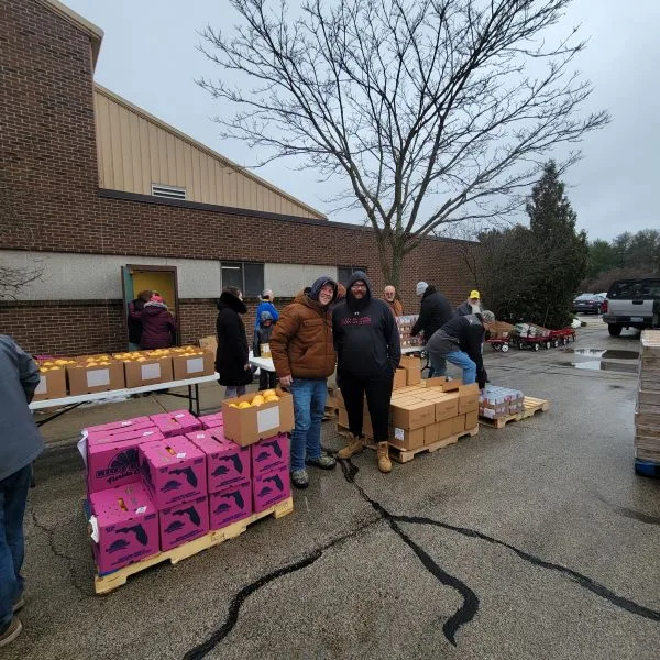 Tom-H-Josh-Feeding-America Tom and Josh posing for a photo at Feeding America event