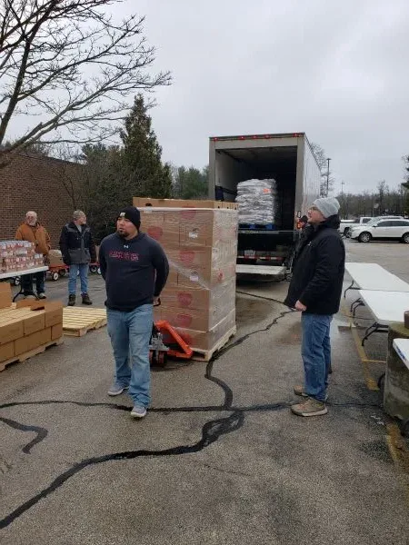 feeding-america-unload-food volunteers unloading the food truck