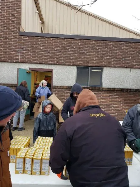 feeding-america-volunteers-2026-10 boxes of food on table at feeding America in Muskegon