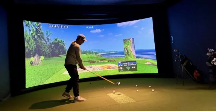 golf-night-swing team member getting ready to swing a golf club