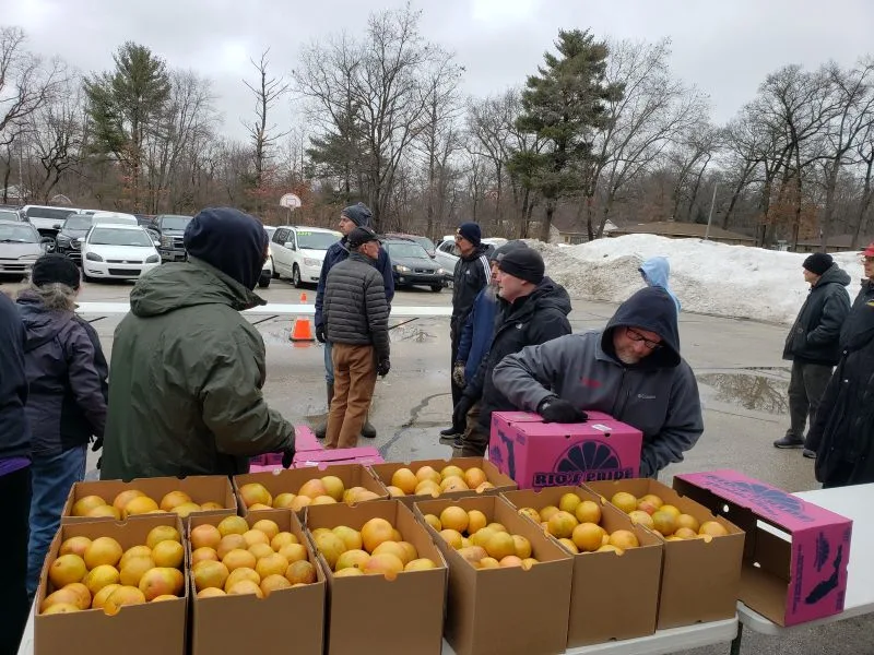 oranges-feeding-america unpacking oranges for feeding America food truck event in Muskegon
