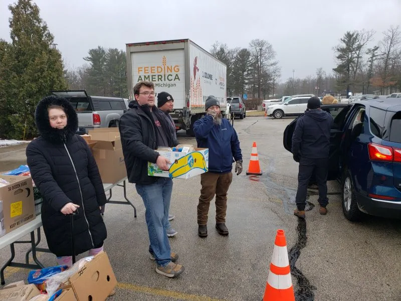 volunteers-feeding-america-wm Volunteers organizing food at charity event