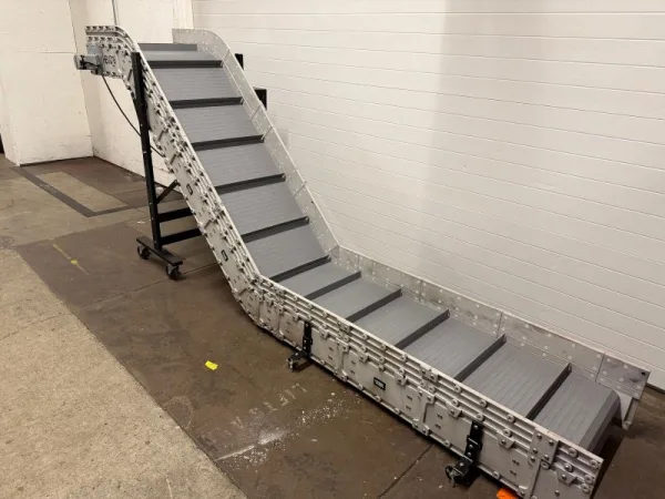 angled view of a Dynacon inclined belt conveyor built for Amcor Rigid Packaging company