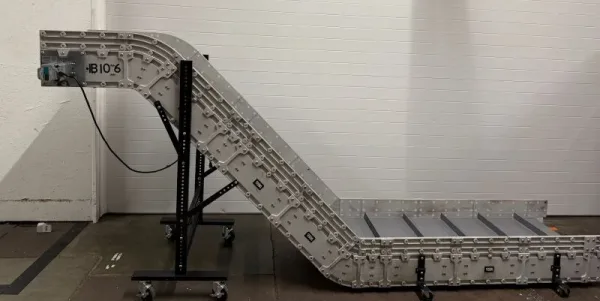 side view showing incline angle of the DynaCon custom conveyor for plastics company