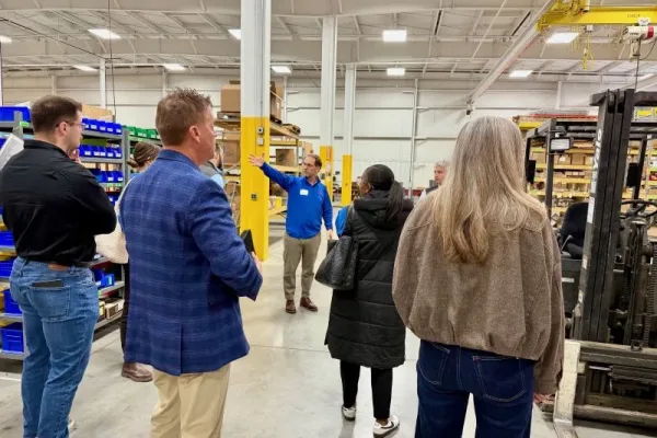 round-table-manufacturers group of visitors with the GMED round table in West Michigan