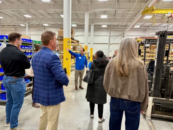 group of visitors with the GMED round table in West Michigan