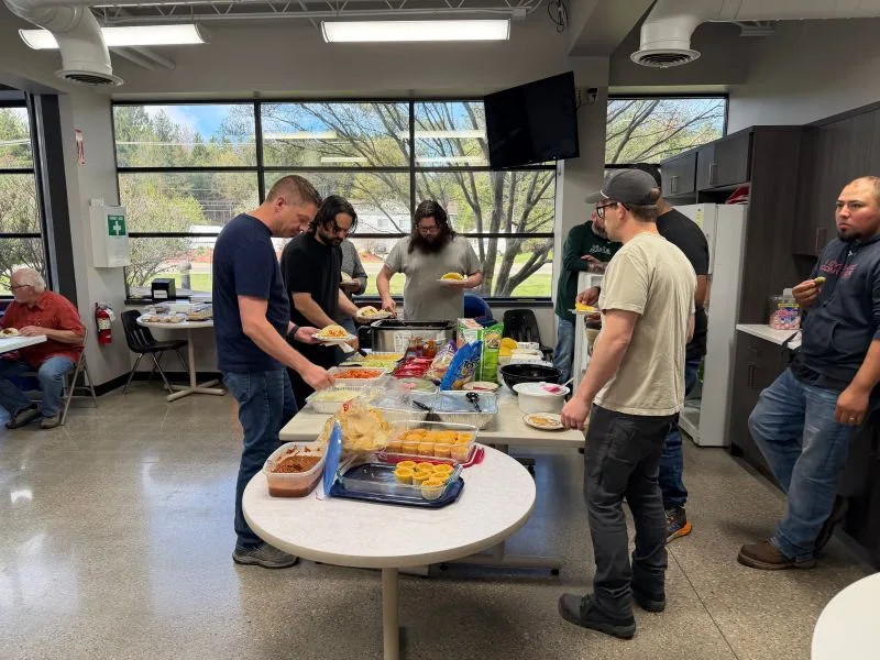 2026-Cinco-De-Mayo-1 team members eating tacos for cinco de mayo 2026