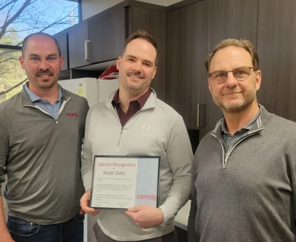 Matt Zehr holding q1 recognition, standing with Jordan Musselman and Steve Wexall