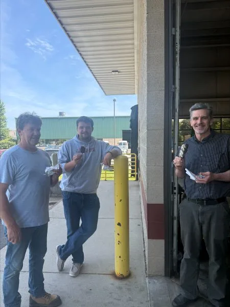 Group-eating-icecream-2026 group of Dynamic Conveyor employees eating ice cream to cool off