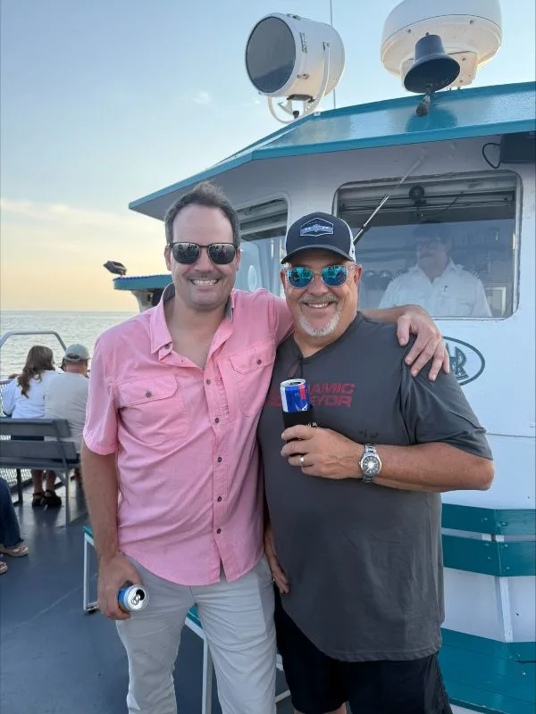 Matt-Jeff-2026-cruise Matt and Jeff on the deck of the boat