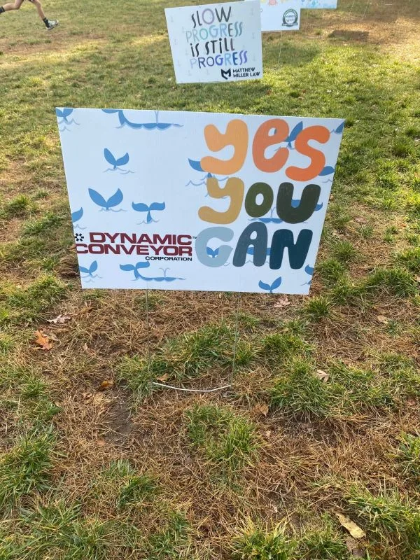 2026-walkathon-Dynamic-Conveyor-Sign Dynamic Conveyor sponsor sign at the 2026 walkathon at Lincoln Park Elementary School