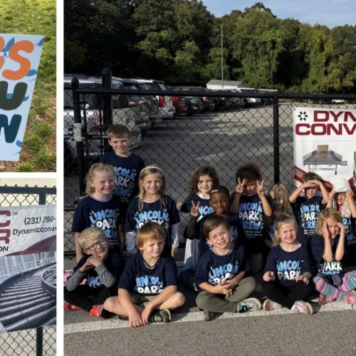 Dynamic Conveyor sponsorship signs and students participating in the walkathon